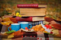 47593647-romantic-autumn-still-life-with-blanket-croissant-book-coffee-cups-and-leaves-top-view.jpg